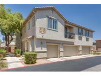 Charming townhome with a private balcony and attached garages in a well-maintained community at 9112 Canoga Canyon Ct # 103, Las Vegas, NV 89149