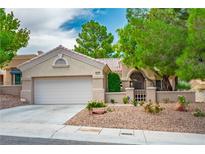 Charming single-story home with a well-maintained desert landscape and a spacious two-car garage at 10646 Heritage Hills Dr, Las Vegas, NV 89134