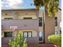 Inviting two-story condo featuring a charming exterior with well-maintained landscaping at 1911 Bluegill Way # D, Henderson, NV 89014