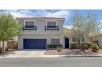 Charming two-story home featuring desert landscaping, a two-car garage, and decorative window awnings at 2367 Tilden Way, Henderson, NV 89074