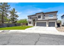 Elegant two-story home featuring a three-car garage, well-maintained landscaping, and a neutral color palette at 3204 Rutledge Dr, Las Vegas, NV 89120