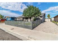 Charming single-story home featuring a modern horizontal fence and well-maintained landscaping at 3682 Deer Creek Way, Las Vegas, NV 89115