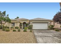 Charming single-story home featuring well-maintained landscaping and a two-car garage at 4311 Fiore Bella Blvd, Las Vegas, NV 89135