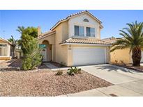 Charming two-story home featuring a well-maintained stucco exterior and a two-car garage at 5332 Desert Blossom Rd, Las Vegas, NV 89107