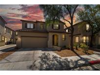 Charming two-story home with a two-car garage and well-manicured landscaping at 632 Monument Point St, Henderson, NV 89002