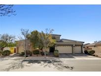 Attractive single-story home featuring a three-car garage, desert landscaping, and a neutral color palette at 7331 Abundant Harvest Ave, Las Vegas, NV 89131