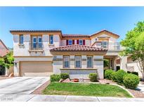 Charming two-story stucco home with a red tile roof, manicured lawn, and an attached two-car garage at 1235 Panini Dr, Henderson, NV 89052