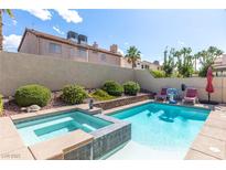 Inviting backyard pool and spa for relaxation and outdoor entertainment, perfect for summer days at 1502 Oxbow Ct, Henderson, NV 89014