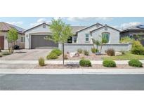 Charming single-story home showcasing a well-kept front yard and a two-car garage at 172 Lunga Ave, Henderson, NV 89011