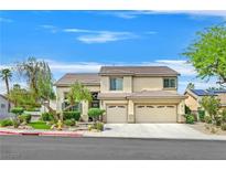 Charming two-story home featuring a three-car garage, mature trees, and well-maintained landscaping at 1780 Crystal Stream Ave, Henderson, NV 89012
