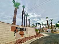 Portofino Condominiums entrance sign with palm trees in a private community at 2016 Mesquite Ln # 302, Laughlin, NV 89029