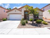 Charming single-story home with well-maintained landscaping and neutral-toned exterior at 203 Sea Rim Ave, Las Vegas, NV 89148