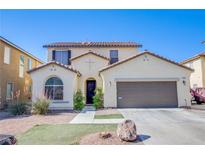 Charming two-story home featuring a well-kept lawn, an attached two-car garage, and desert landscaping at 4429 E Azure Ave, Las Vegas, NV 89115