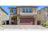Charming two-story home with a two-car garage and inviting front entry at 5966 Icicle Falls Ave, Las Vegas, NV 89130