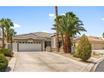 Charming single-story home with a well-maintained front yard and a two-car garage at 7920 Aspect Way, Las Vegas, NV 89149