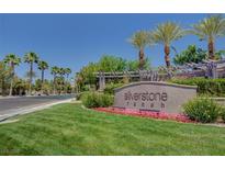 Silverstone Ranch community entrance sign with lush landscaping and mature palm trees under a bright blue sky at 8564 Mayport Dr, Las Vegas, NV 89131