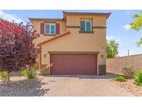 Charming two-story home with a two car garage and low maintenance landscaping at 9161 Rolling Sky Dr, Las Vegas, NV 89178