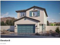 Charming two-story home with a two-car garage, stylish blue accents, and desert landscaping at 1425 Gable Falls Dr # 93, North Las Vegas, NV 89084
