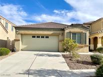 Charming single-story home showcasing a well-maintained front yard and a spacious two-car garage at 3809 Van Ness Ave, North Las Vegas, NV 89081