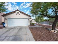 Charming single-story home with a well-maintained front yard and a two-car garage, offering curb appeal and convenience at 3913 Lilac Haze St, Las Vegas, NV 89147