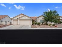 Charming single-story home featuring a two-car garage, desert landscaping, and a classic Southwestern style at 4628 Standing Bluff Way, Las Vegas, NV 89130