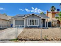 Charming single-story home with a fenced yard and modern architectural details at 5417 Eastbrook Dr, Las Vegas, NV 89142