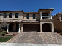 Attractive two-story home featuring a three-car garage and a beautifully paved driveway at 6454 Mount Palomar Ave, Las Vegas, NV 89139