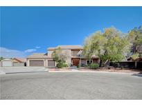 Charming two-story home featuring a three-car garage and well-maintained landscaping at 6821 Jeanette St, Las Vegas, NV 89131