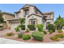 Beautiful two-story home featuring desert landscaping, neutral paint, and attached garage at 8204 Chimney Bluffs St, North Las Vegas, NV 89085