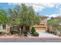 Charming two-story home boasts a well-maintained front yard and a spacious two-car garage at 8224 Fowler Falls Ct, North Las Vegas, NV 89085
