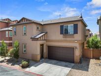 Charming two-story home featuring a two-car garage and well-maintained landscaping at 9053 Boston Springs Ave, Las Vegas, NV 89149