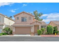 Charming two-story home featuring a 2-car garage and well-maintained landscaping at 927 Clear Diamond Ave, Las Vegas, NV 89123