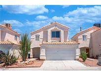 Charming two-story townhome featuring desert landscaping and an attached two car garage at 1436 Padre Bay Dr, Las Vegas, NV 89108