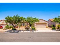 Charming single-story home with a two-car garage and desert landscaping at 2106 King Mesa Dr, Henderson, NV 89012