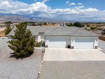 Expansive ranch-style home with attached two-car garage and beautiful mountain views at 3451 Sagebrush Ave, Pahrump, NV 89048
