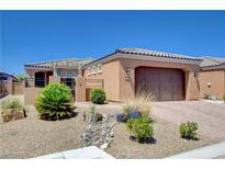 Charming single-story home featuring low-maintenance desert landscaping and a two-car garage at 3616 Greenbriar Bluff Ave, North Las Vegas, NV 89081