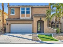 Inviting two-story home with attached garage, landscaped front yard and walkway at 62 Myrtle Springs Ct, Las Vegas, NV 89148