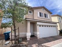 Charming two-story home with a two-car garage and a well-maintained front yard at 7249 Linaria Rd, Las Vegas, NV 89113