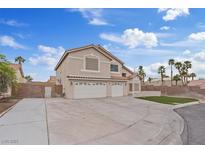 Charming two-story home features a three-car garage, well-maintained landscaping, and a spacious driveway at 7711 Lofty Hill Ct, Las Vegas, NV 89123