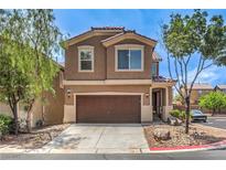 Charming two-story home featuring a well-maintained front yard, and a convenient two-car garage at 9005 Semillon St, Las Vegas, NV 89148