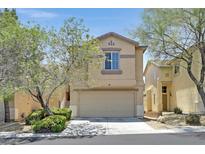 Charming two-story home featuring desert landscaping, neutral colors, and an attached two-car garage at 9105 White Eyes Ave, Las Vegas, NV 89143
