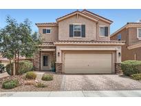 Charming two-story home with a well-manicured front yard and inviting curb appeal at 9853 Bangalore Ct, Las Vegas, NV 89148