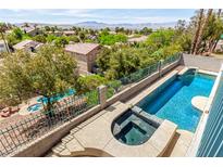 Inviting backyard oasis with a private pool and hot tub, perfect for relaxation and outdoor enjoyment at 1339 Echo Creek St, Henderson, NV 89052