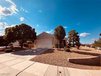 Charming single-story home with a well-manicured, low-maintenance front yard and attached two-car garage at 2504 Libretto Ave, Henderson, NV 89052