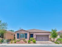 Charming single-story home with a well-manicured front yard and attached two-car garage at 280 Via Del Duomo, Henderson, NV 89011