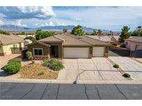 Charming single-story home featuring a three-car garage and a well-maintained front yard at 854 Santa Maria Way, Mesquite, NV 89027