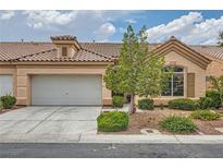 Charming single-story home featuring a well-maintained yard and a two-car garage at 9622 Emeraude Ave, Las Vegas, NV 89147