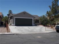 Charming single-story home with desert landscaping, and a spacious two-car garage at 2211 Chipplegate Way, North Las Vegas, NV 89032