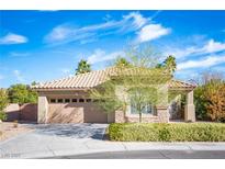 Charming single-story home featuring a manicured front yard, neutral tones, and a two-car garage at 340 Autumn Palace Ct, Las Vegas, NV 89144
