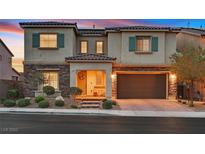 Charming two-story home showcasing a stone facade, tile roof, and inviting front porch at 404 Lost Horizon Ave, Henderson, NV 89002
